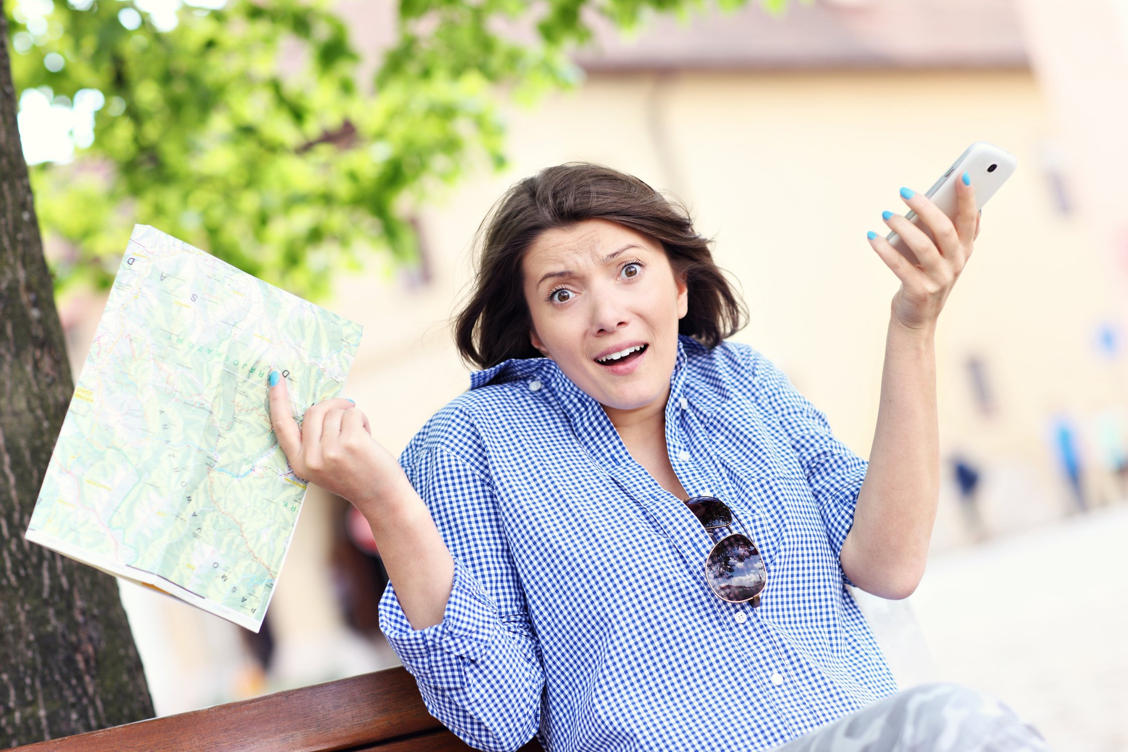 Lost Woman with Map and Cellphone